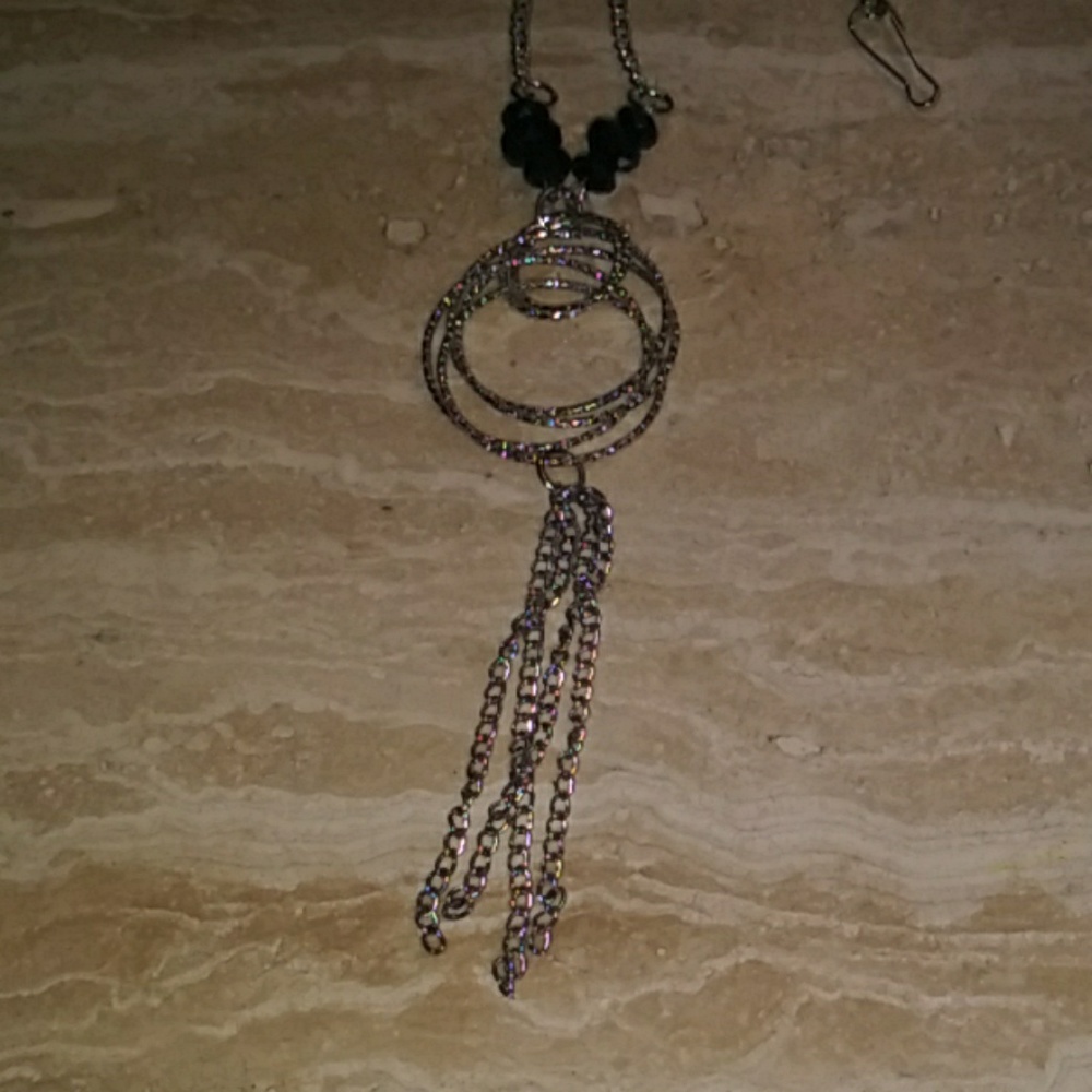 Silver tone adjustable necklace.